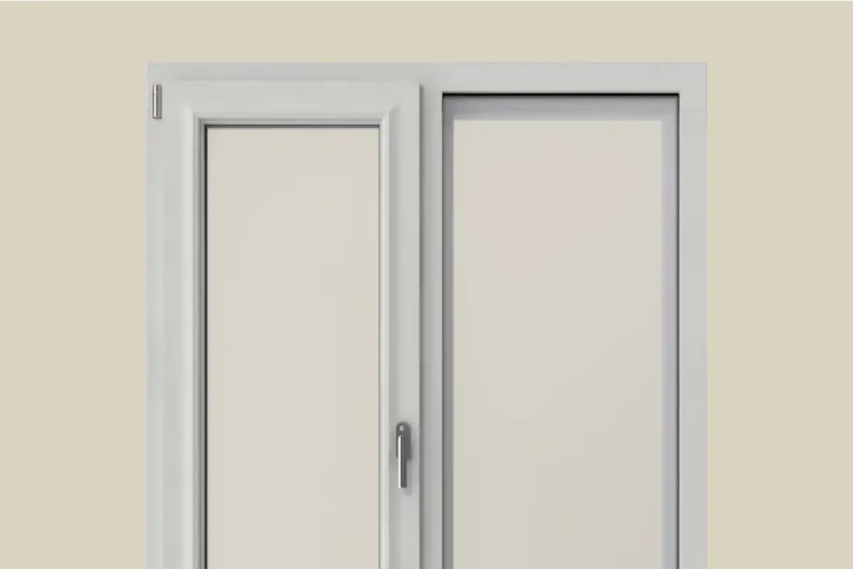 White double-panel window with a handle on the left panel set against a beige wall.
