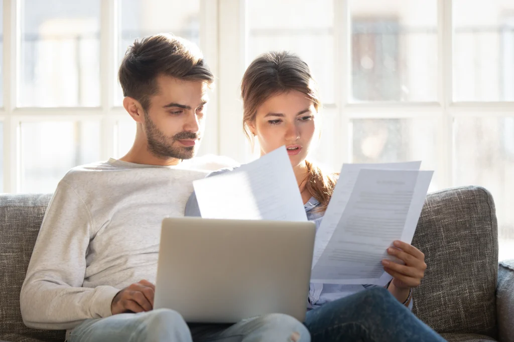 2 people breaking down their energy contract to read the terms