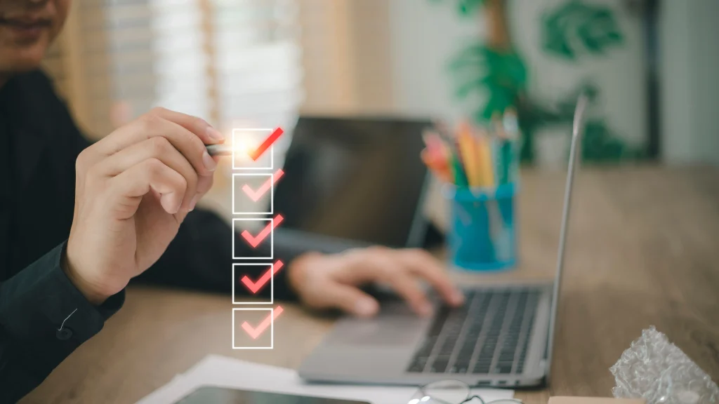 business woman checking off her energy audit checklist