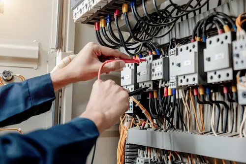 an electric panel being worked on