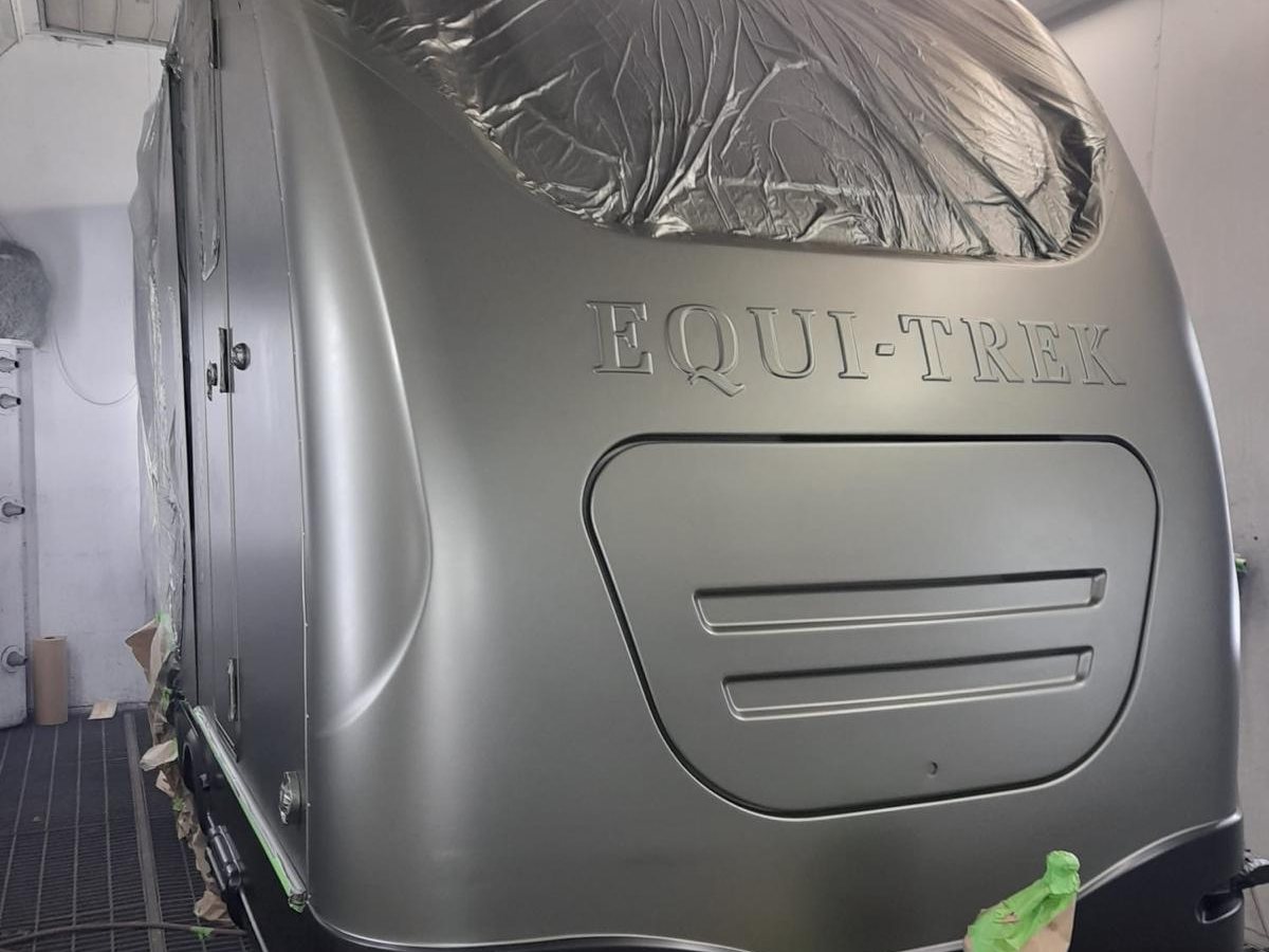 Long-wheelbase vehicle refinish inside the spray booth