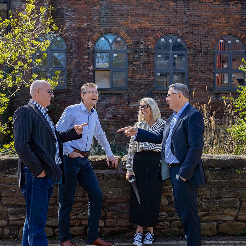 Eximia staff talking together outside