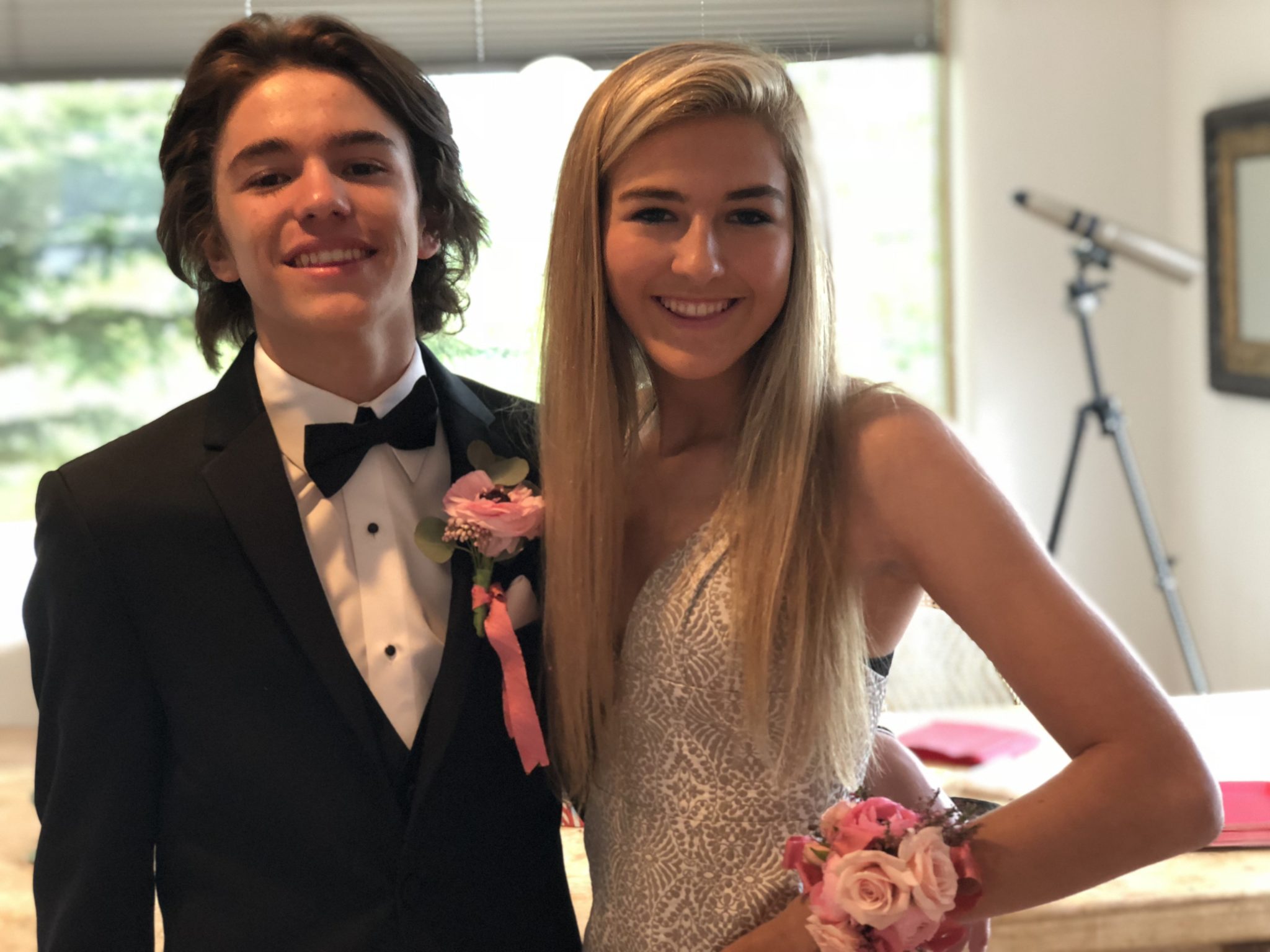 Prom couple posing outdoors