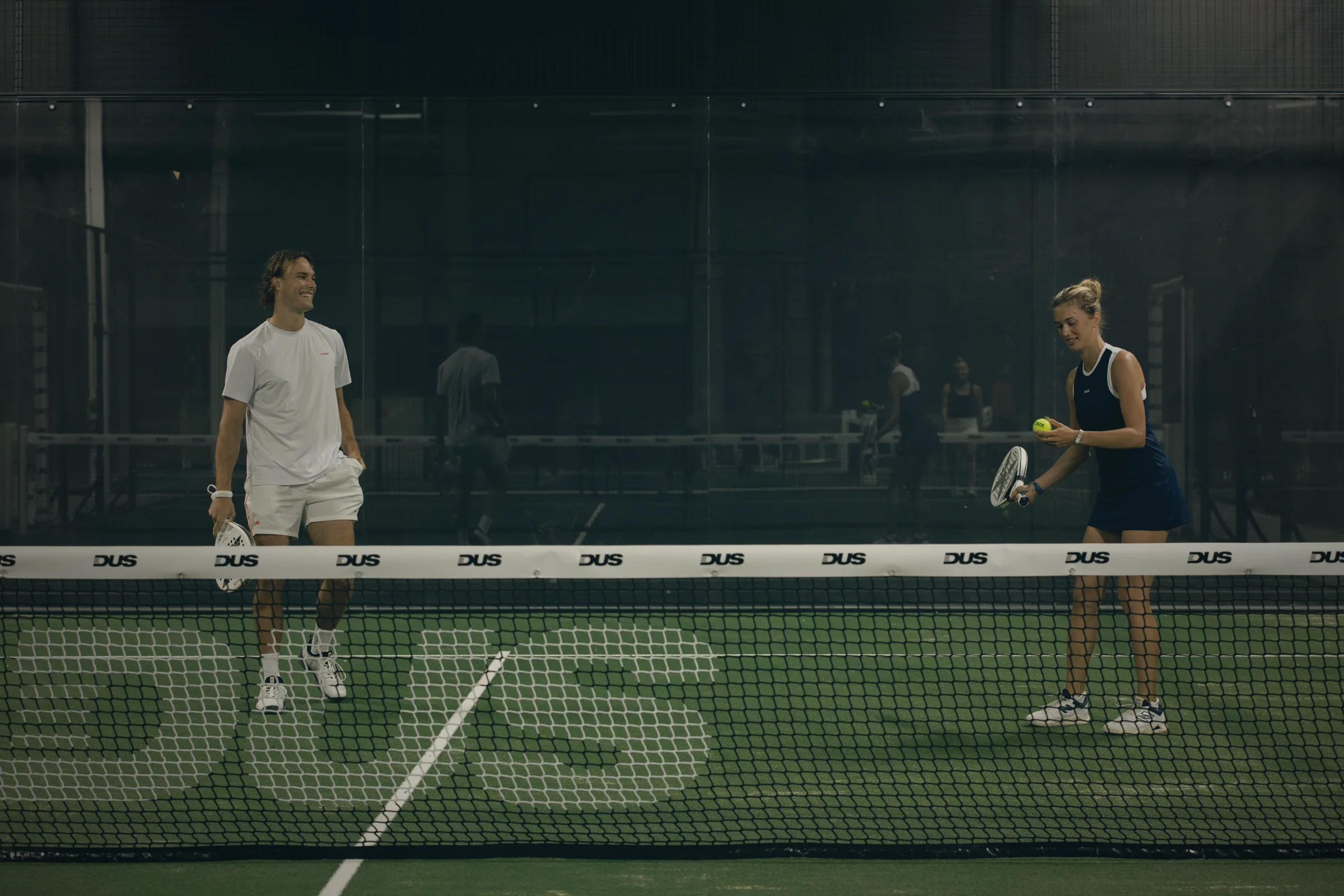 Doubles padel match on an indoor court at DUS Padel, West Palm Beach