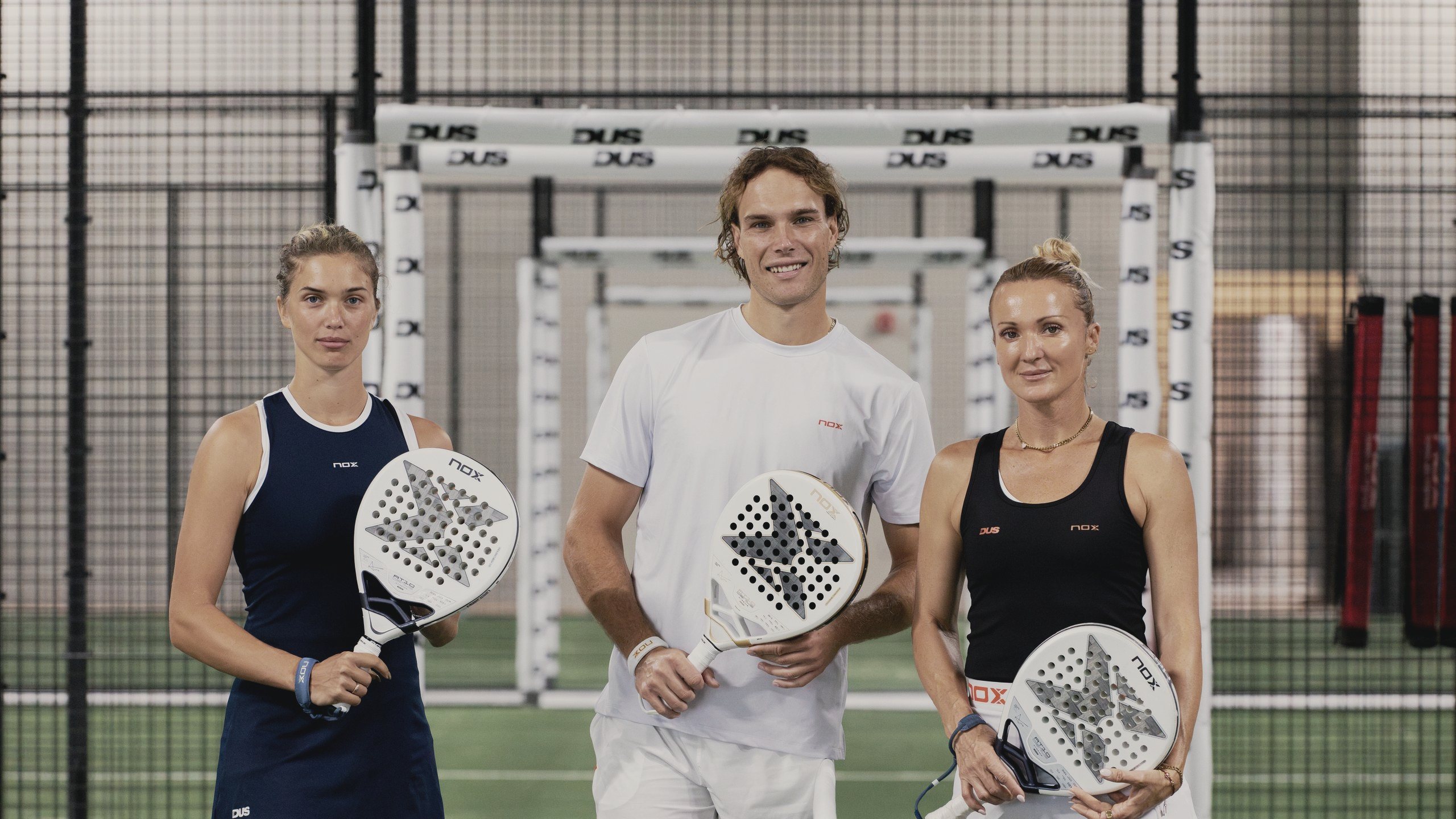 Three DUS coaches on the indoor courts at DUS West Palm Beach