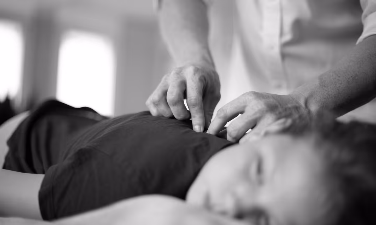 Person receiving receiving chiropractic care.