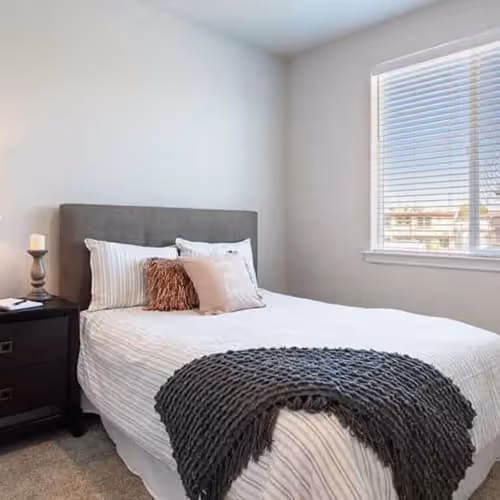 Bedroom with bed and large window