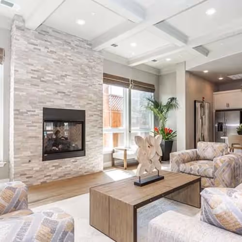 Residence lounge featuring seating area with fire place and kitchen