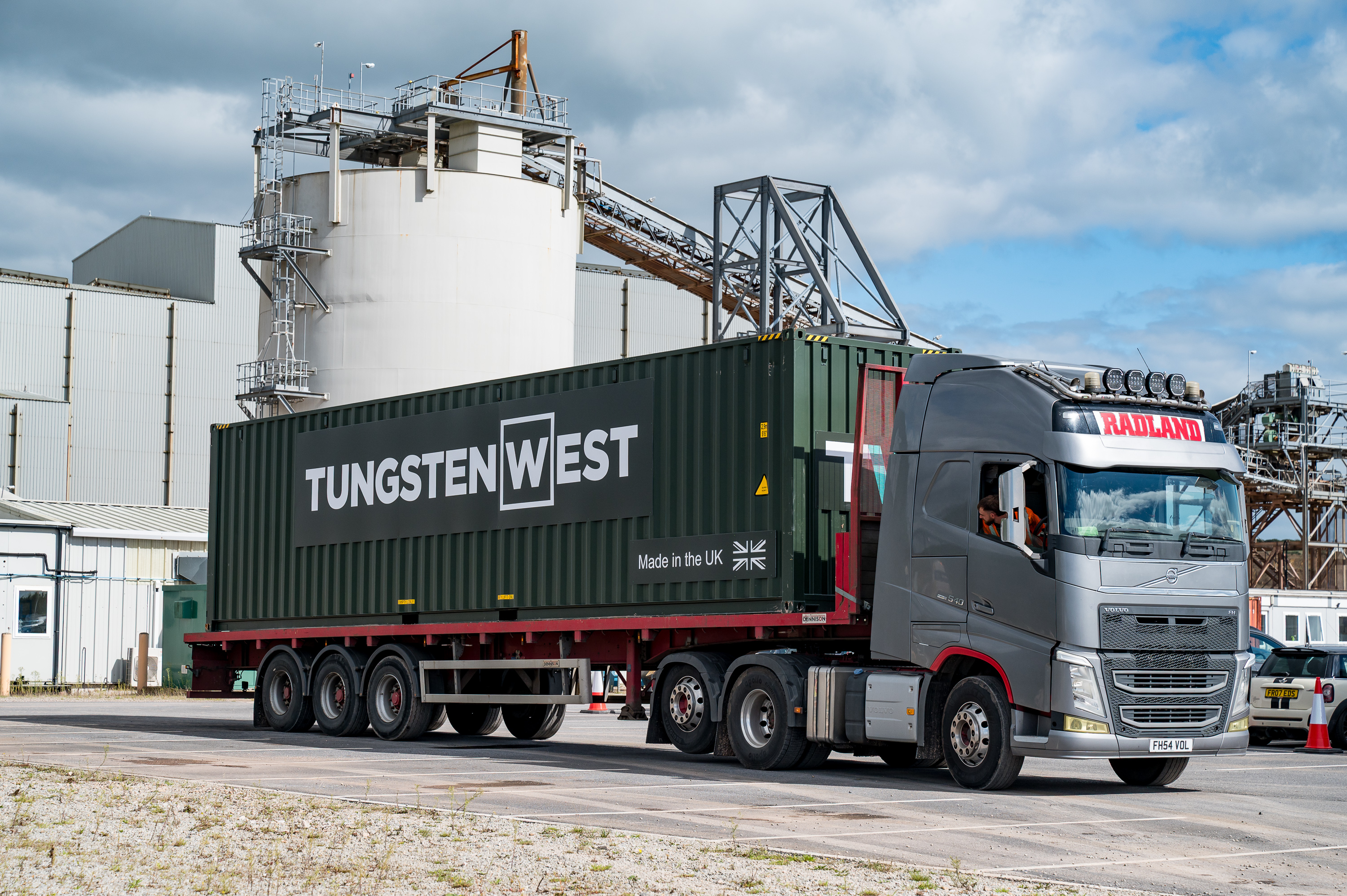 Placeholder: Tungsten West branded lorry carrying a shipping container