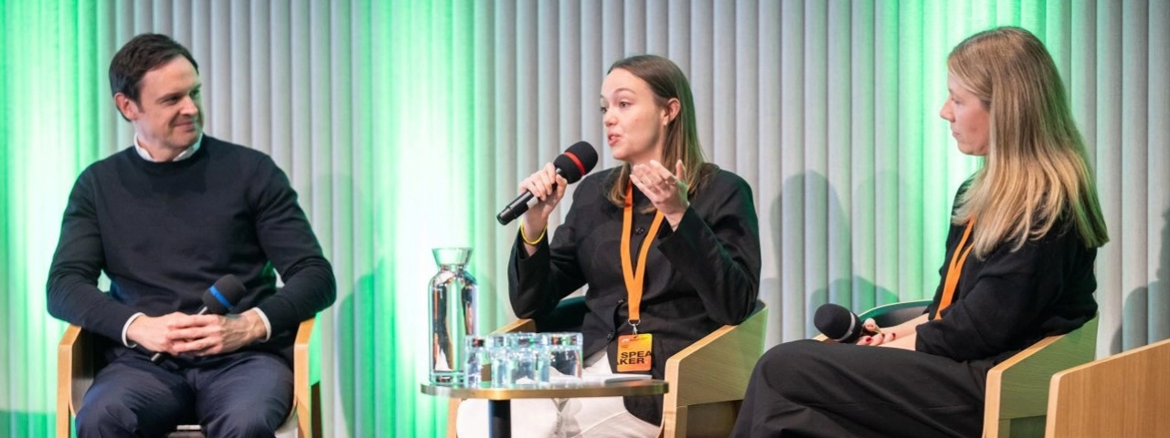 Three panelists speaking at JV26