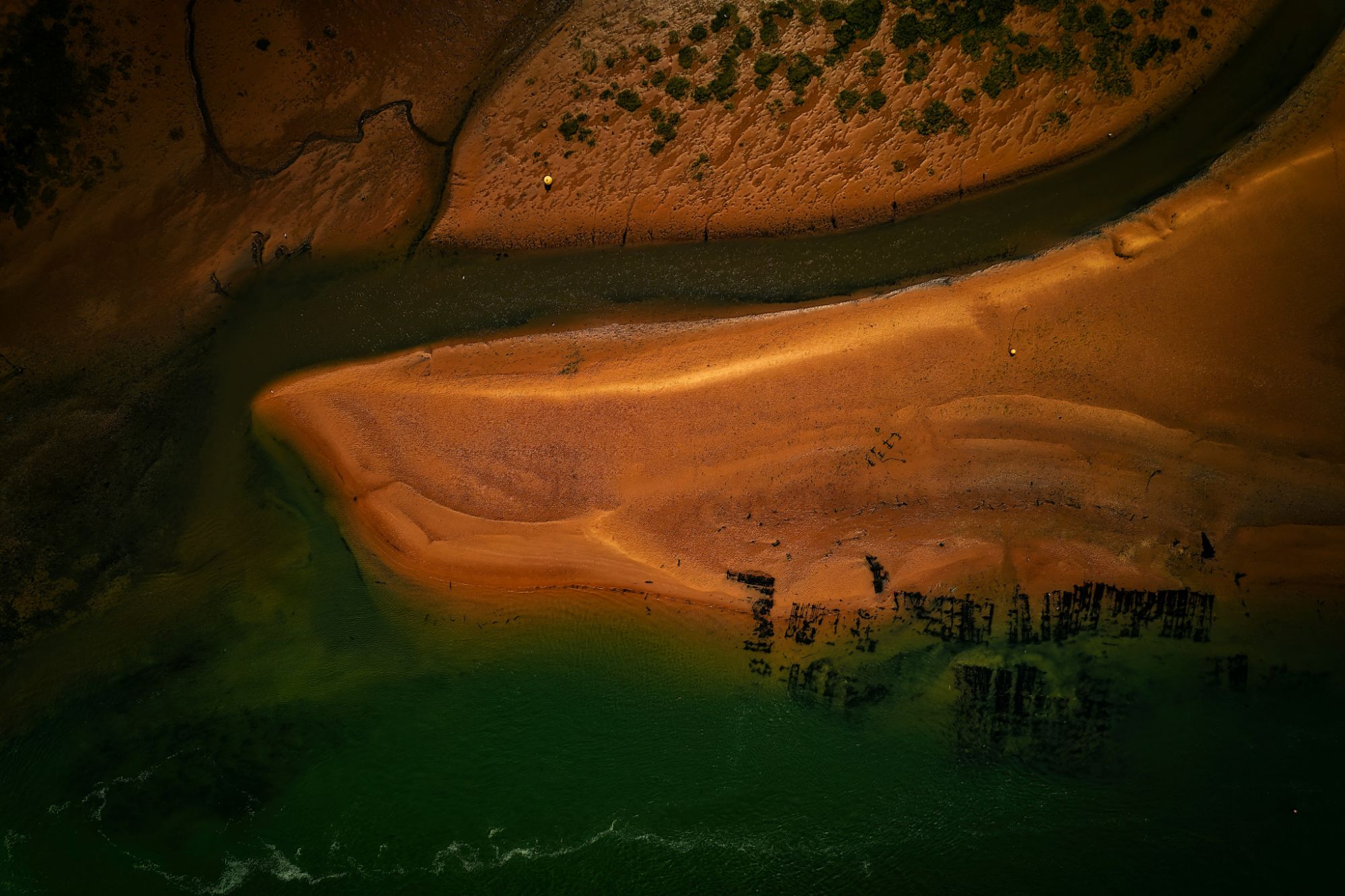 Aerial view of a sandbank crossed by a channel