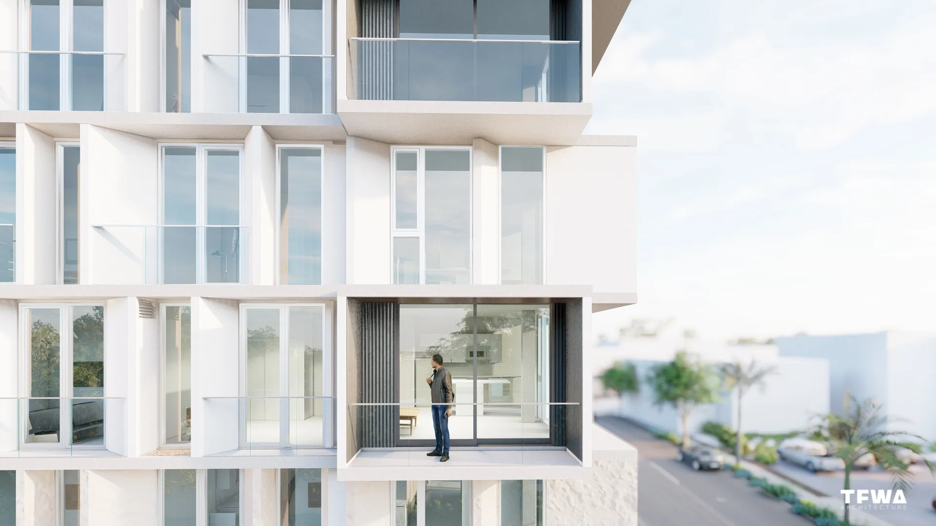 Modern white apartment building facade with balconies and a man standing on one balcony, overlooking the street.