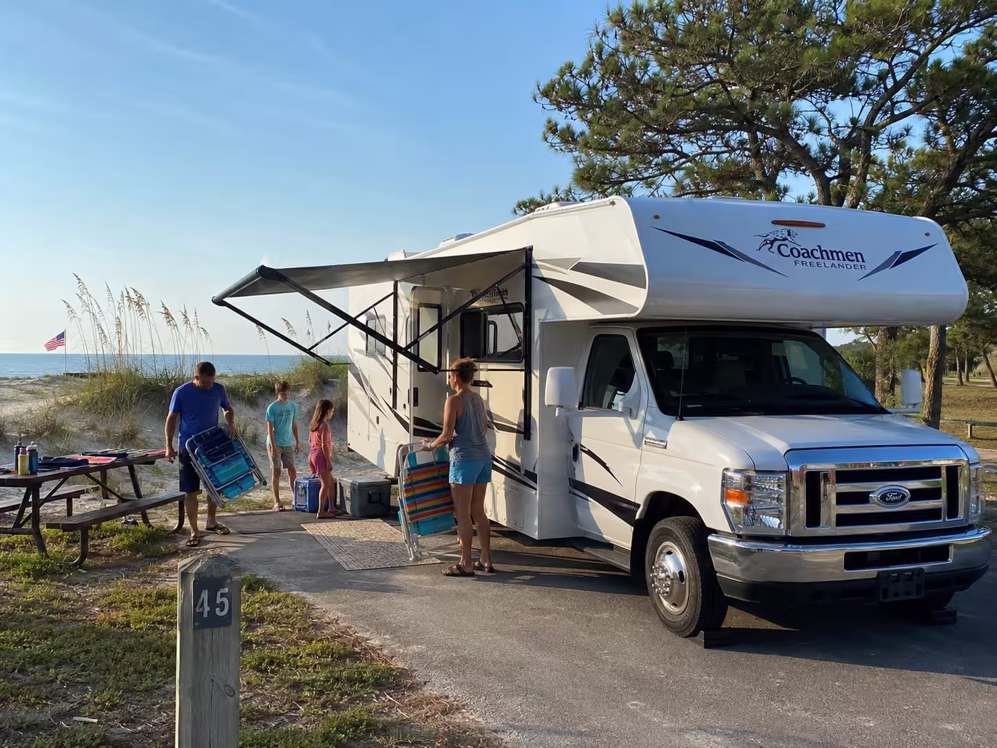 Class C motorhome parked at a Pensacola Beach campground