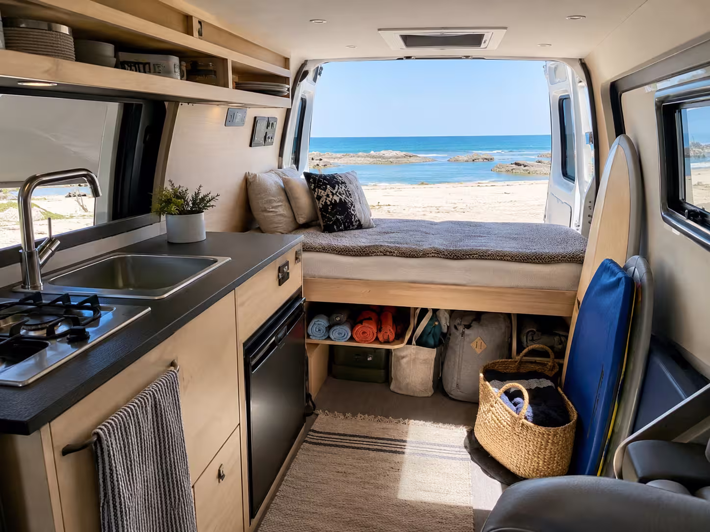 Camper van interior kitchen and sleeping area