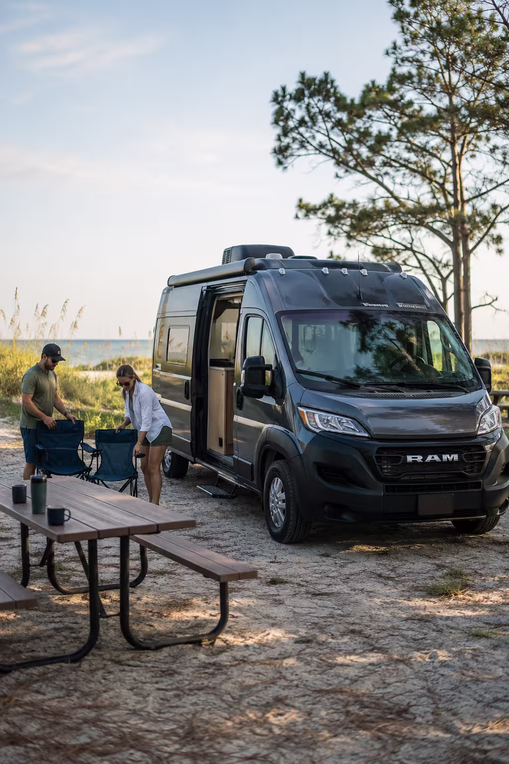 Compact camper rental parked at a Pensacola Beach campground
