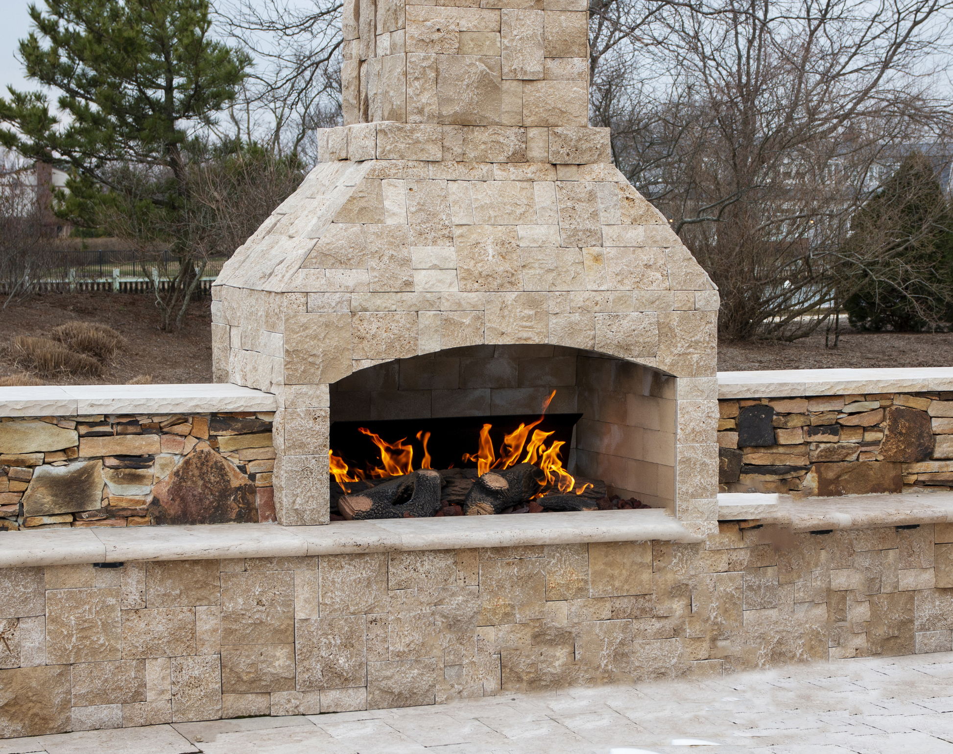 Outdoor fireplace and patio living space — Greater Birmingham area hardscape contractor