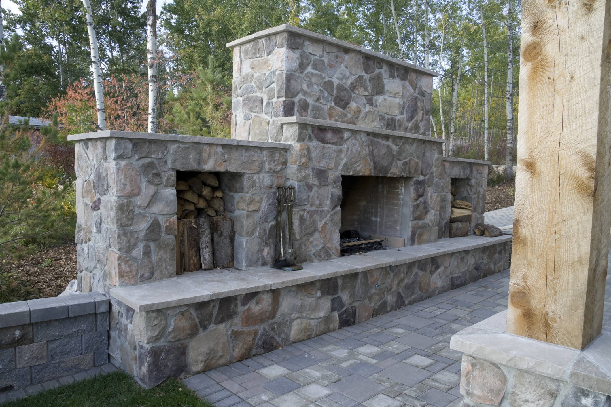 outdoor chairs, a patterned ottoman...  Outdoor fire feature and patio seating — Birmingham AL hardscape and landscape project