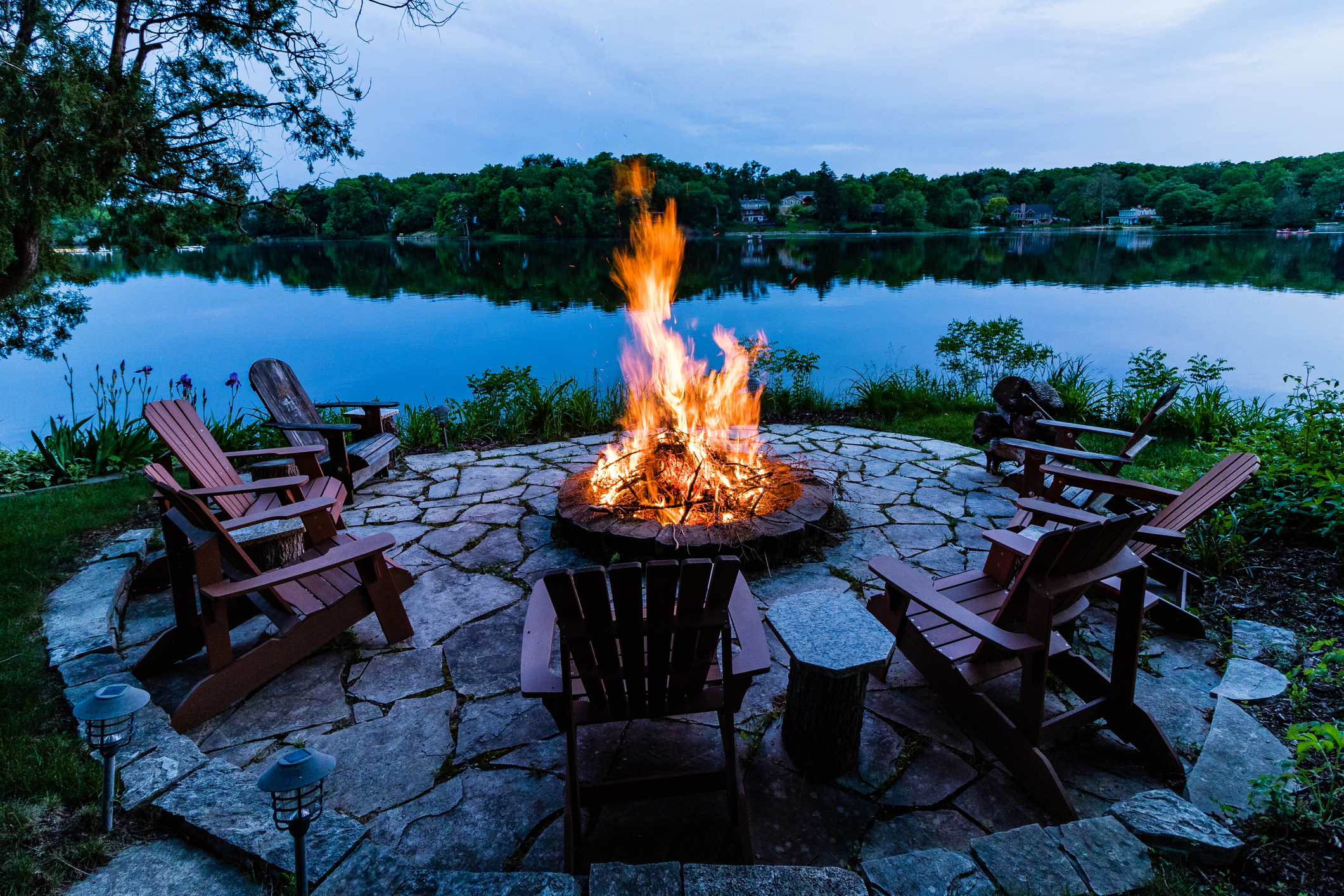 Outdoor fire feature and living space on Alabama lake property — Wood-Palmer design build design