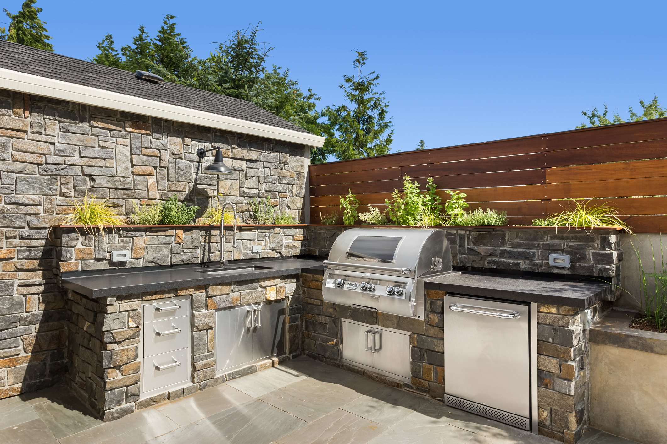 Outdoor kitchen and entertaining space — Homewood AL patio and grill island build