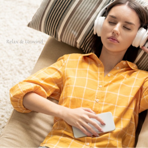 Woman relaxing with headphones during a guided hypnotherapy session
