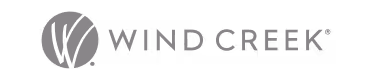 Wind Creek Hospitality logo with stylized vertical lines above text.