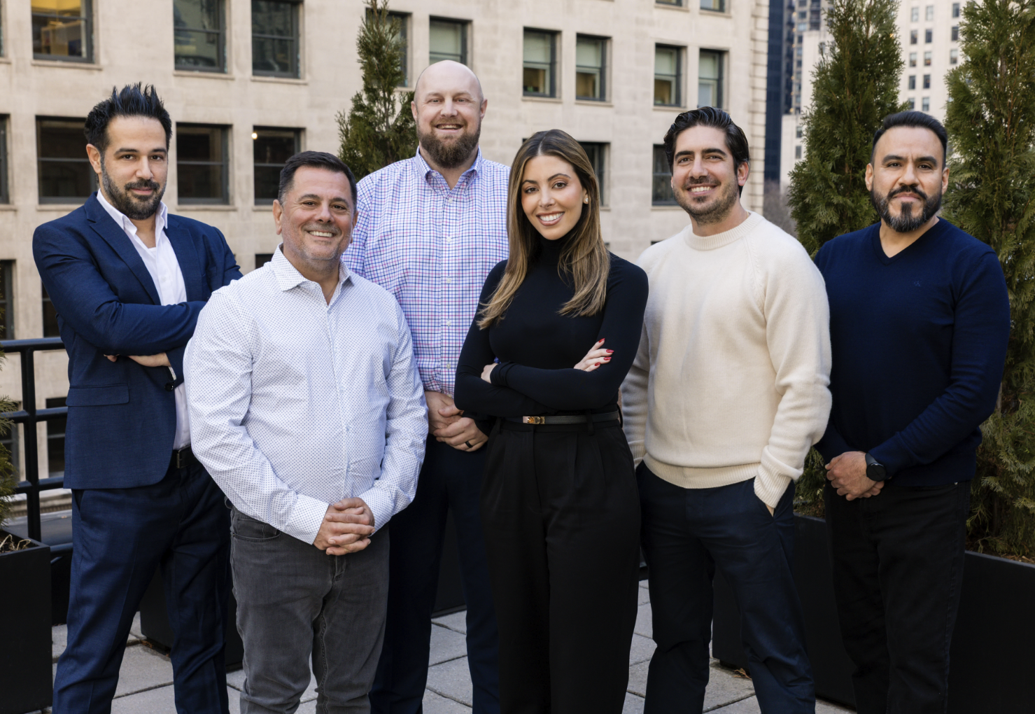 The Pan Brothers Associates team outside the firm's Manhattan office