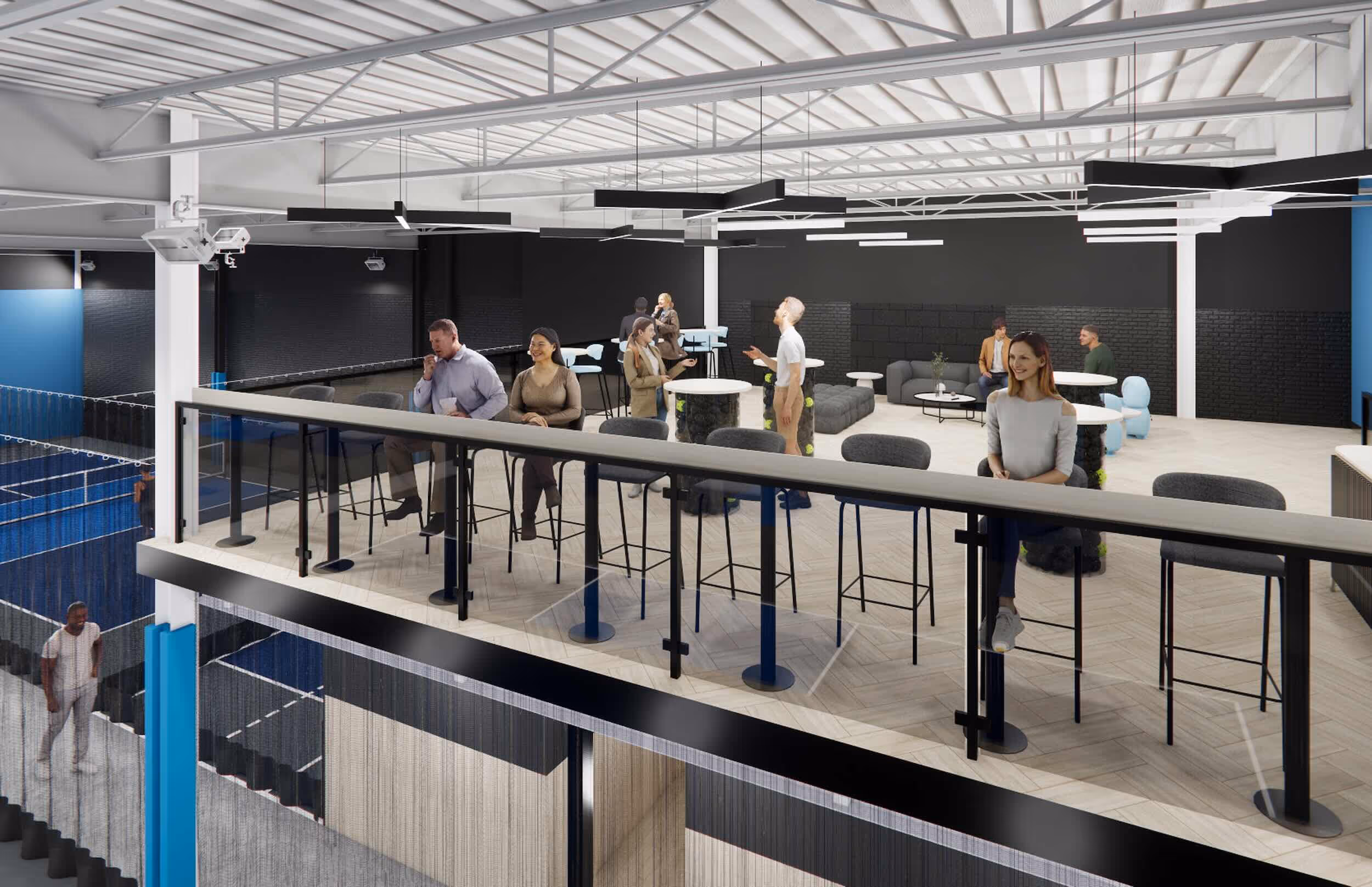 Modern indoor lounge area with people seated at tables and high chairs overlooking a sports court below.
