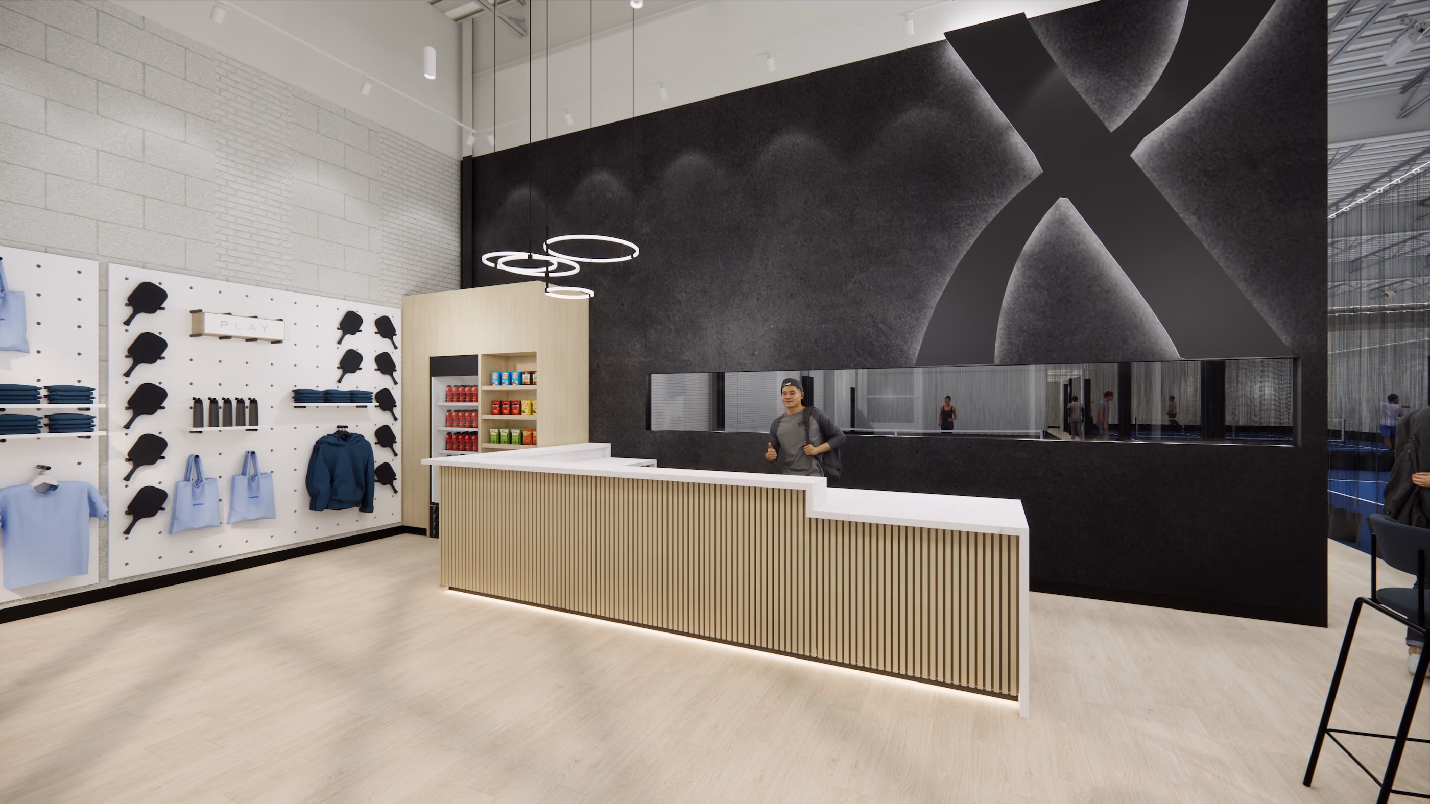 Modern reception area with wooden desk, black accent wall, hanging lights, and merchandise display on side wall.