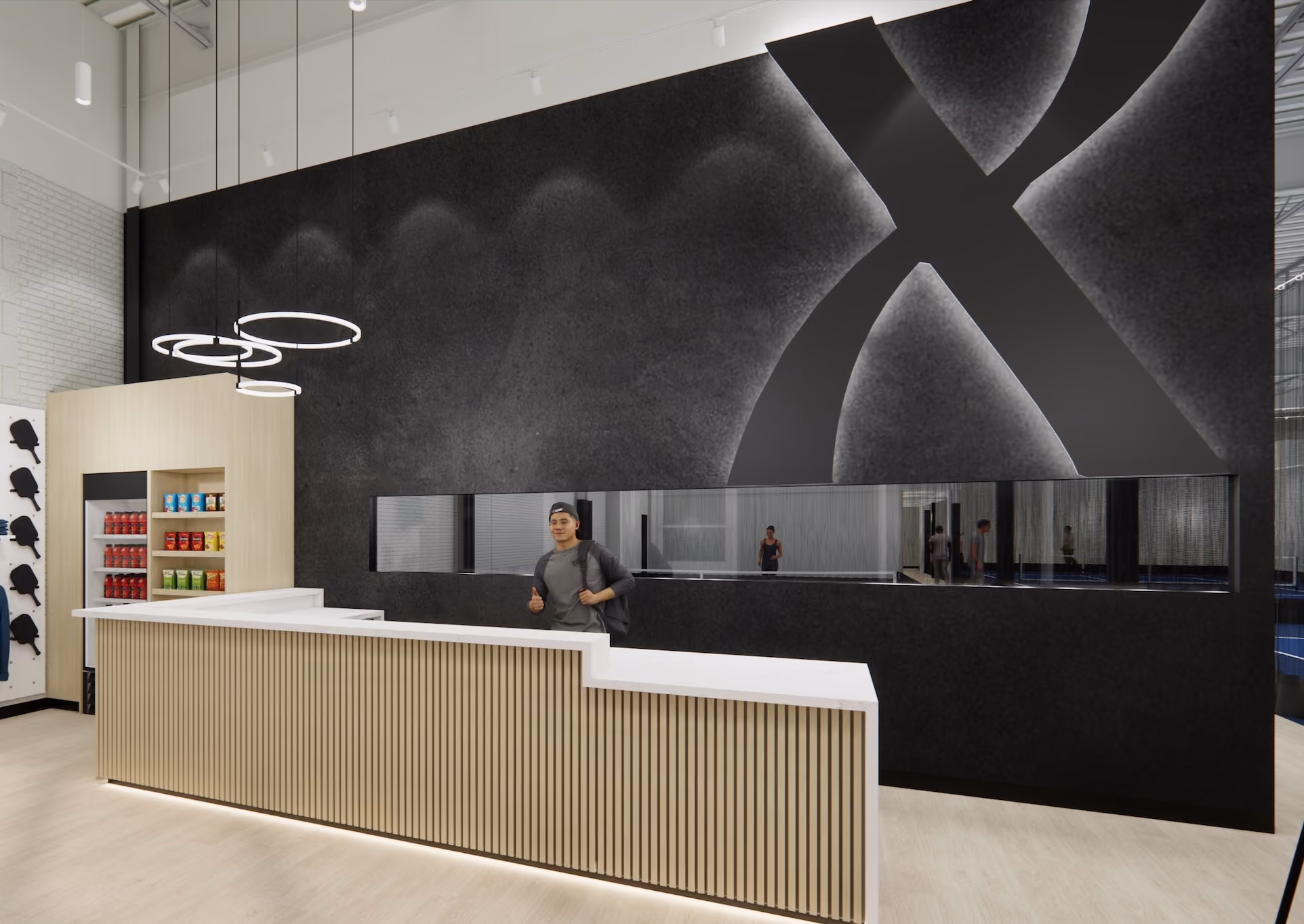Modern reception with wood-panel counter, circular light fixtures, and a black wall with a large illuminated X.