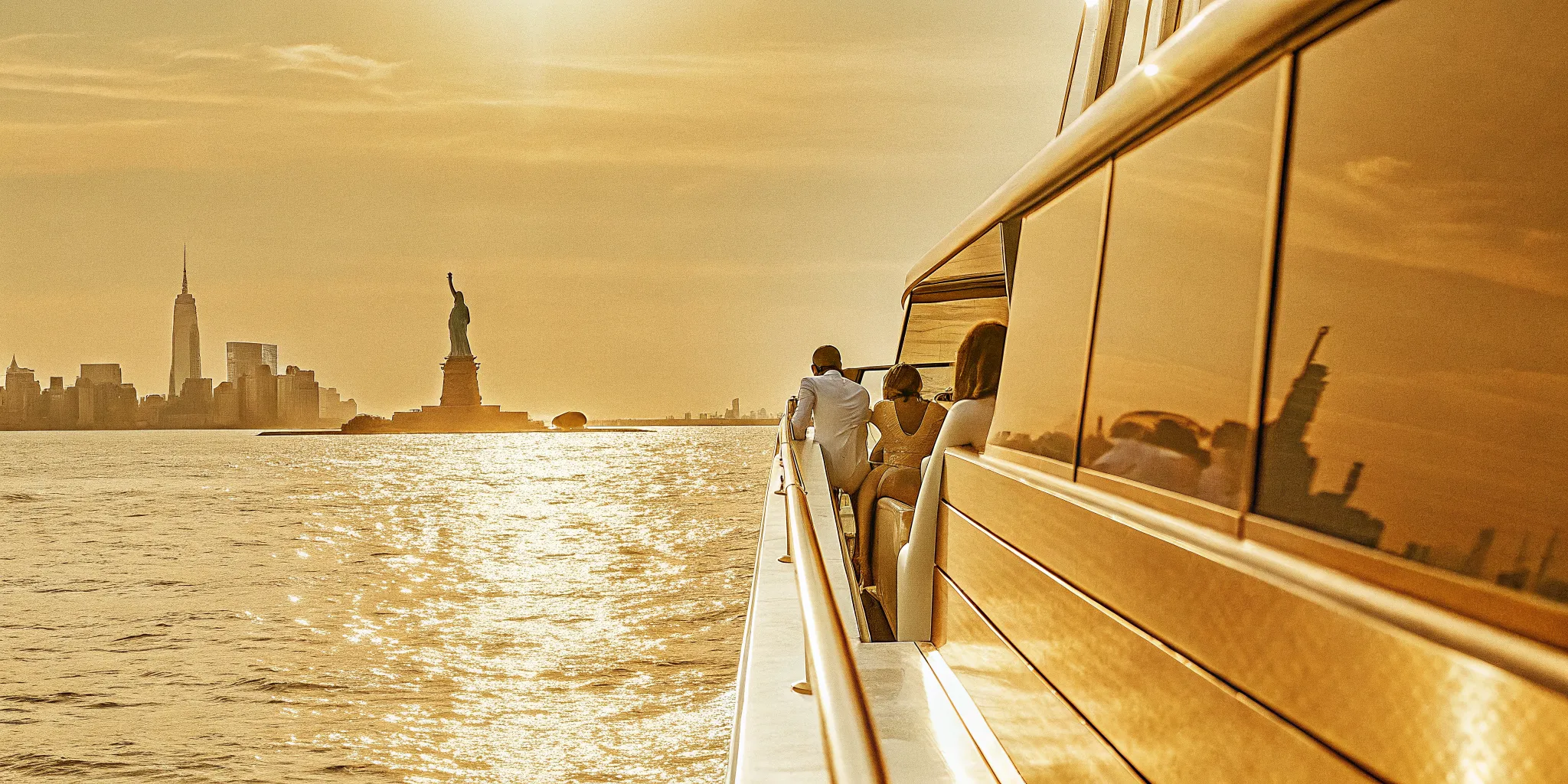 Chelsea Piers proposal cruise yacht at sunset near the Statue of Liberty in New York Harbor