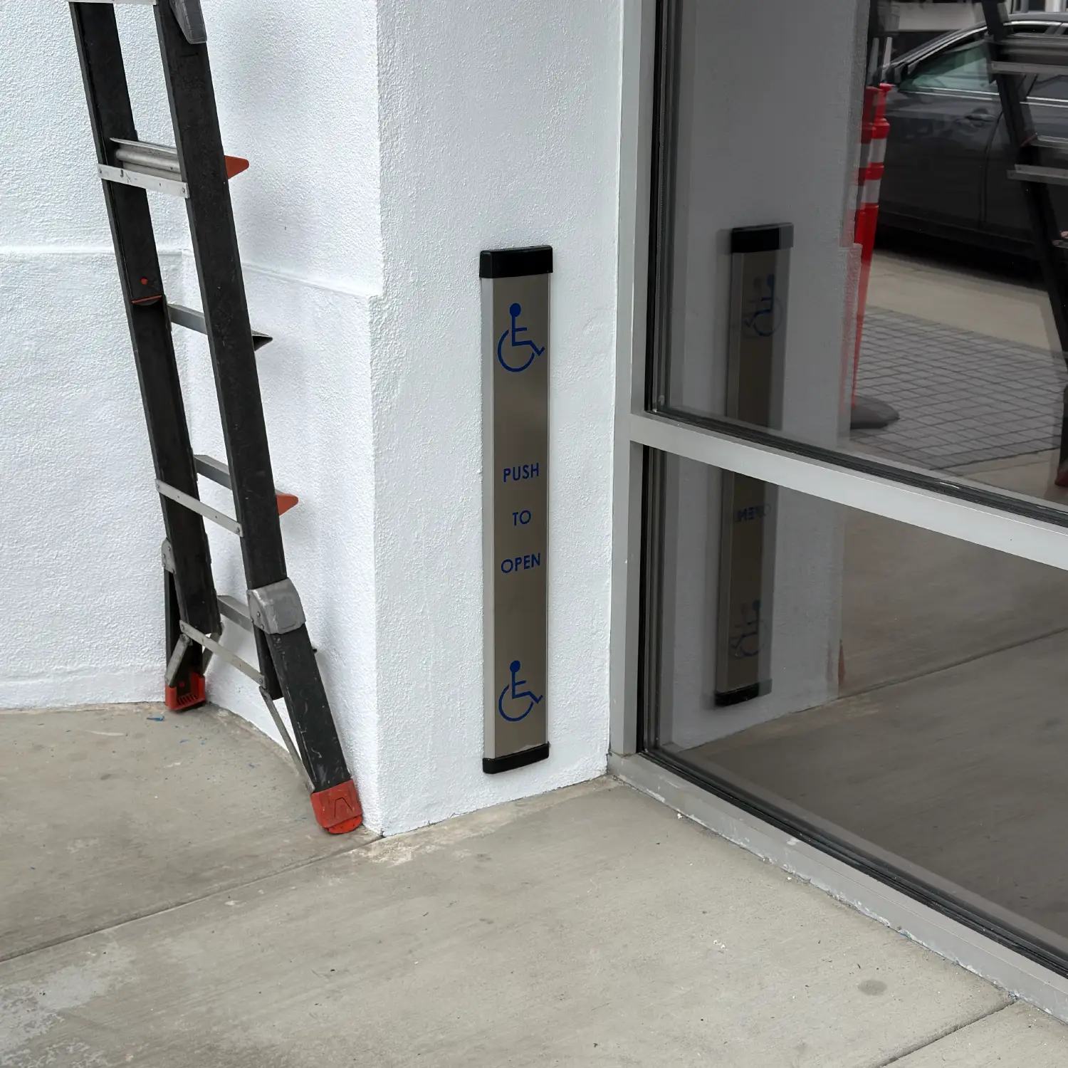 Installed Camden Column push switch activating an automatic door