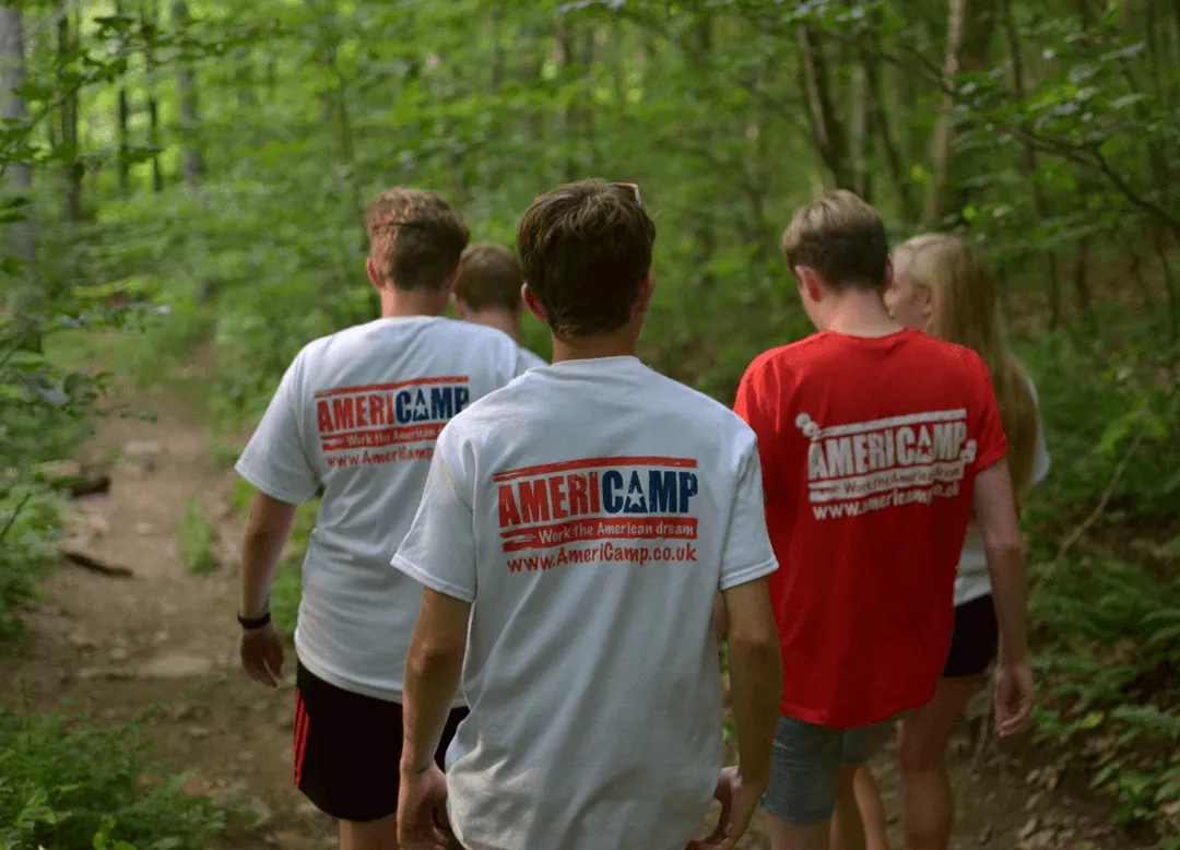 Americamp participants enjoying an outdoor nature hike at summer camp in the USA.