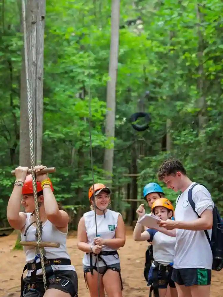 AmeriCamp Camp Counsellors at a USA summer camp enjoying ropes activities.