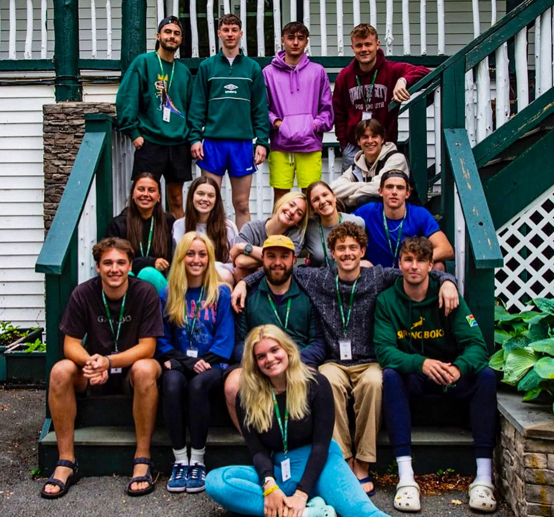Australian students socializing around a campfire at AmeriCamp AU summer camp in USA.
