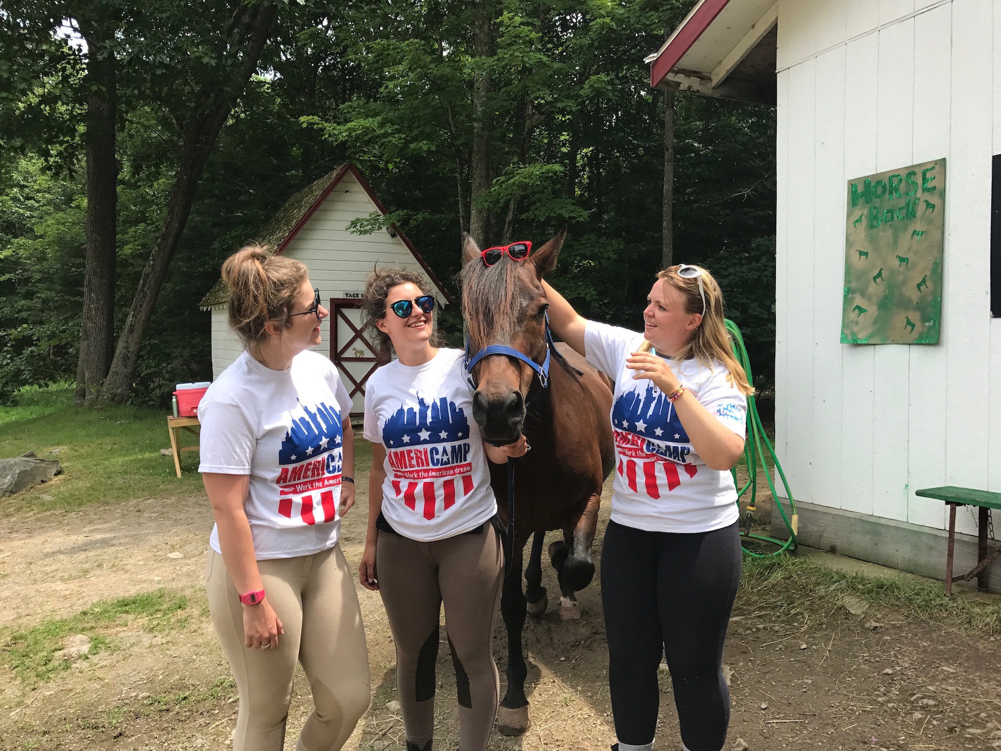 Americamp Counsellors with a horse at summer camp