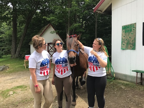 Americamp Counsellors with a horse at summer camp