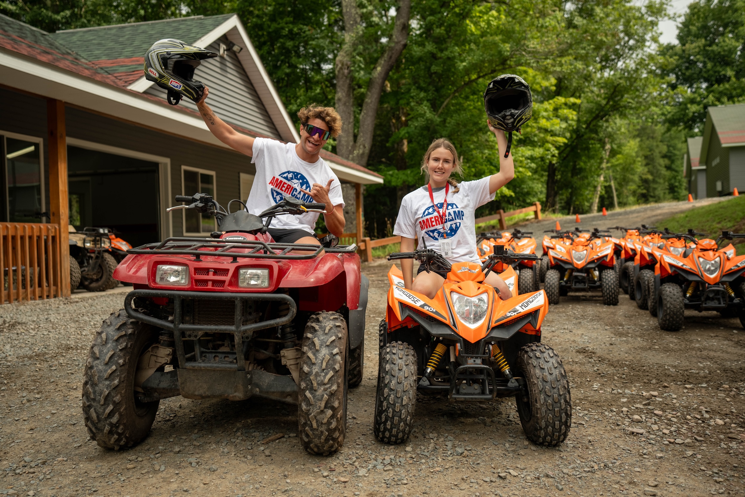 AmeriCamp counsellors at camp on ATV