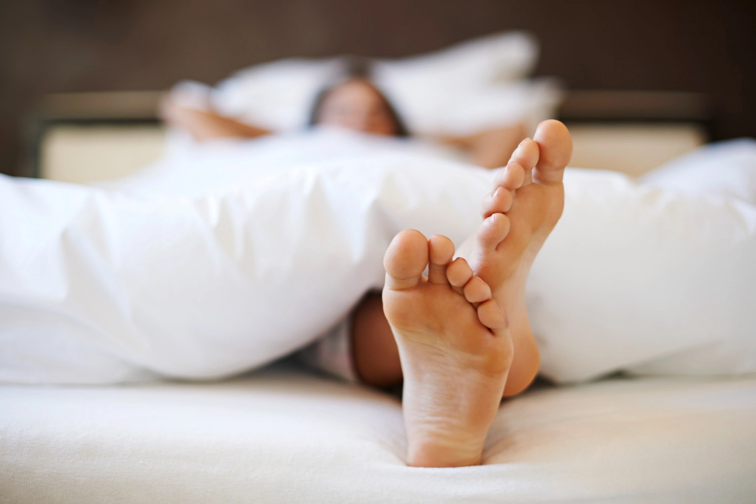 Healthy bare feet on clean white surface