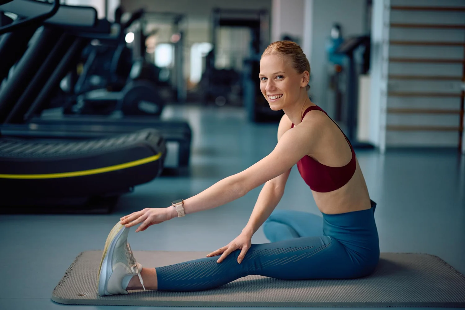 Athlete during workout, hands visible, minimal gym background
