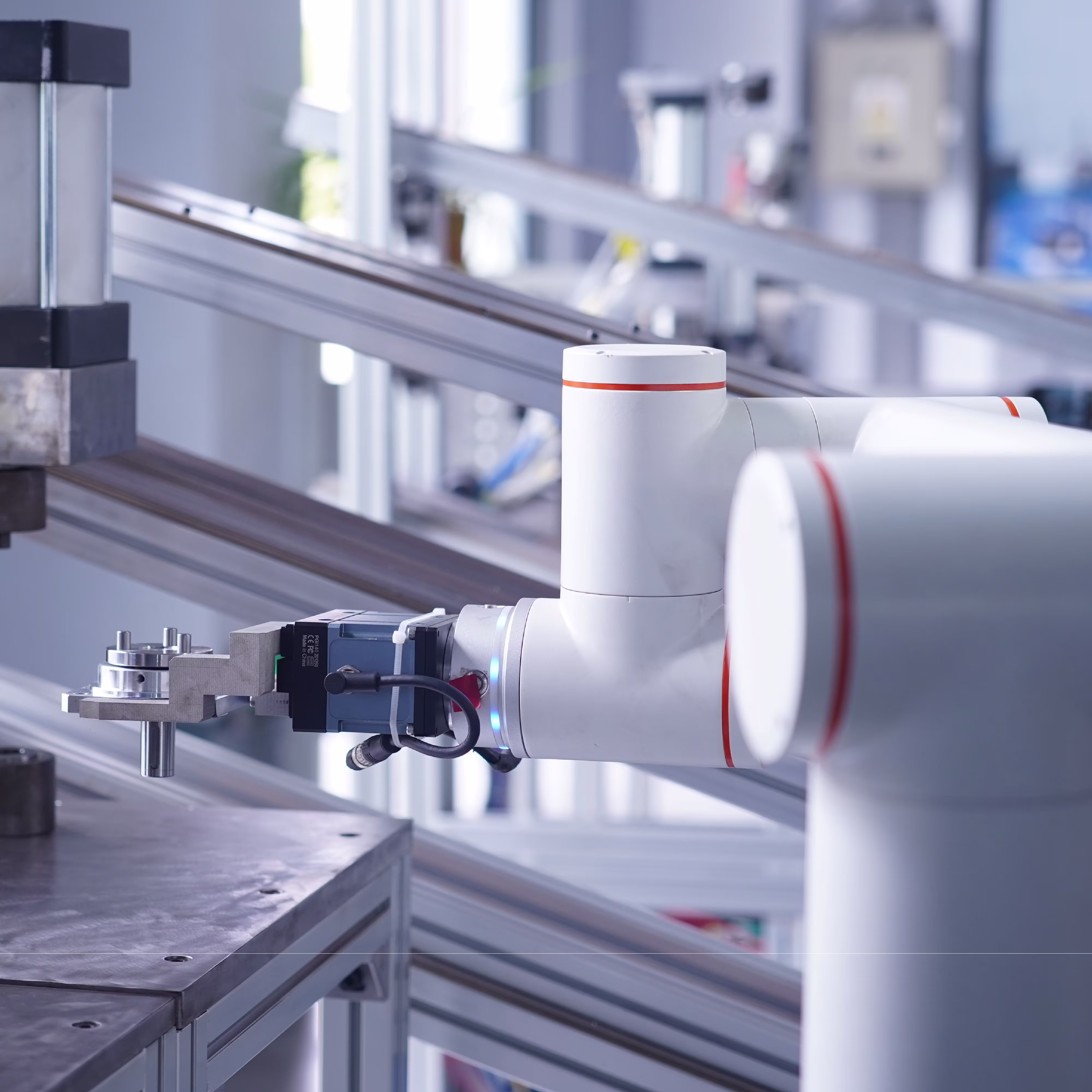 A collaborative robot arm performs a precise task in a modern industrial workspace.