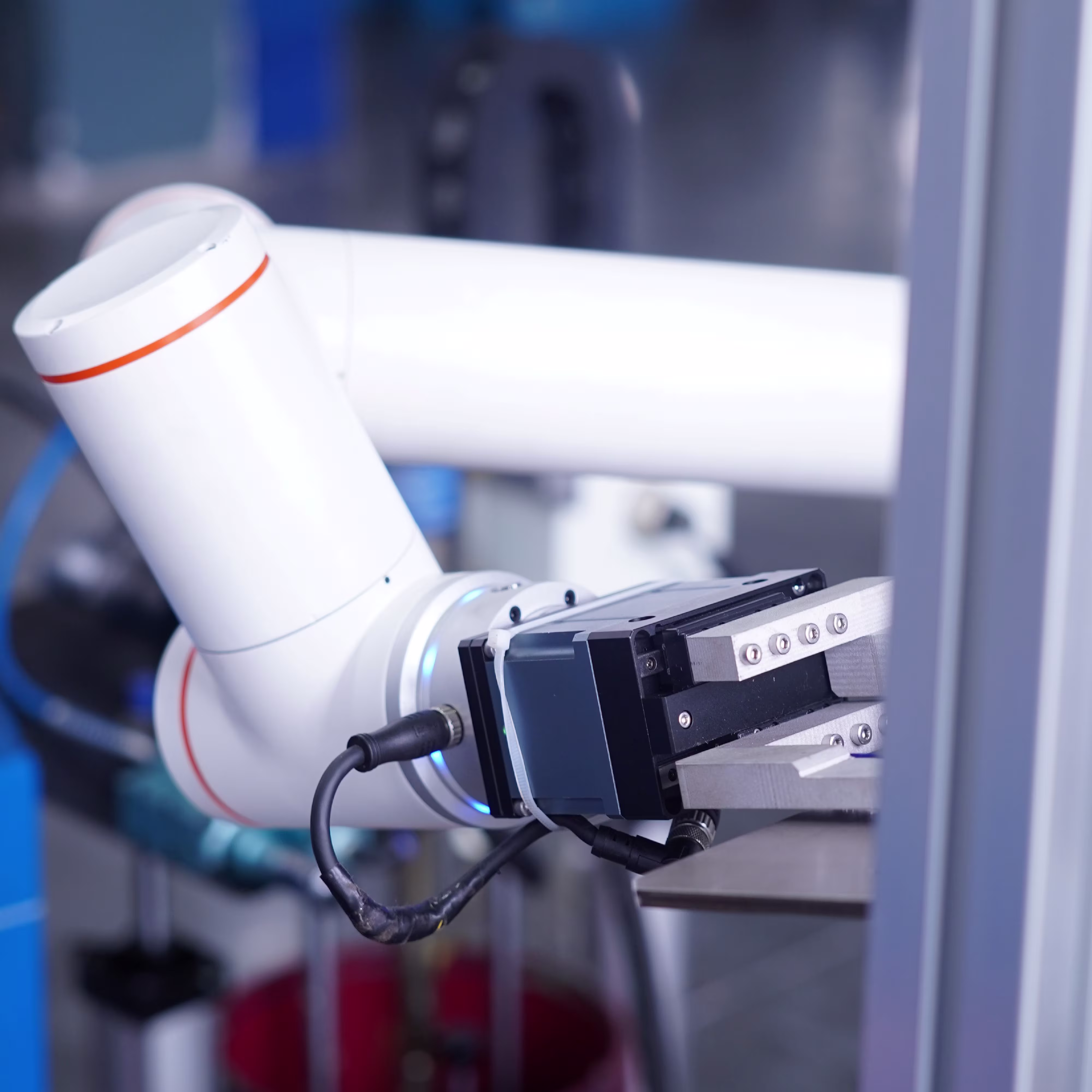 A specialized robotic system interacts with objects in a clean, high-precision environment.