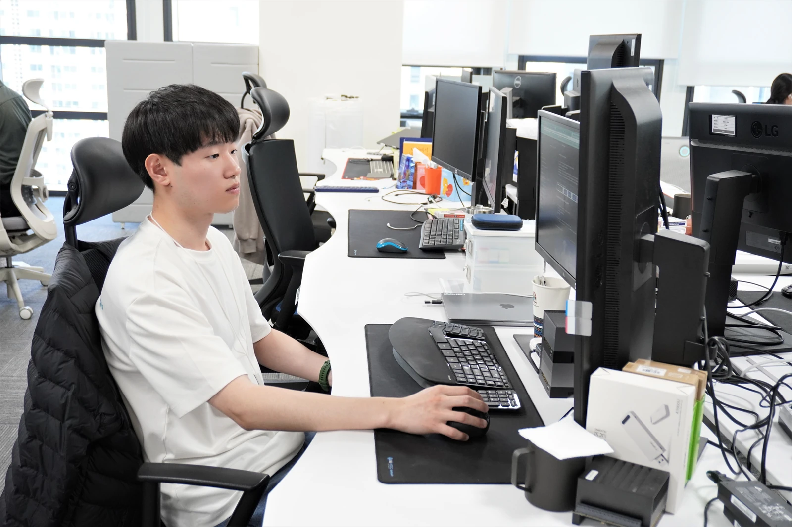 The focused demeanor of Taeyoung dedicated to work