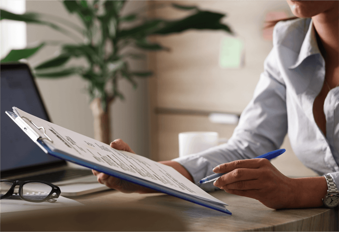 6720f7f57e292640806f608c_unrecognizable-female-entrepreneur-analyzing-business-reports-while-working-paperwork-office 2-p-1080.png