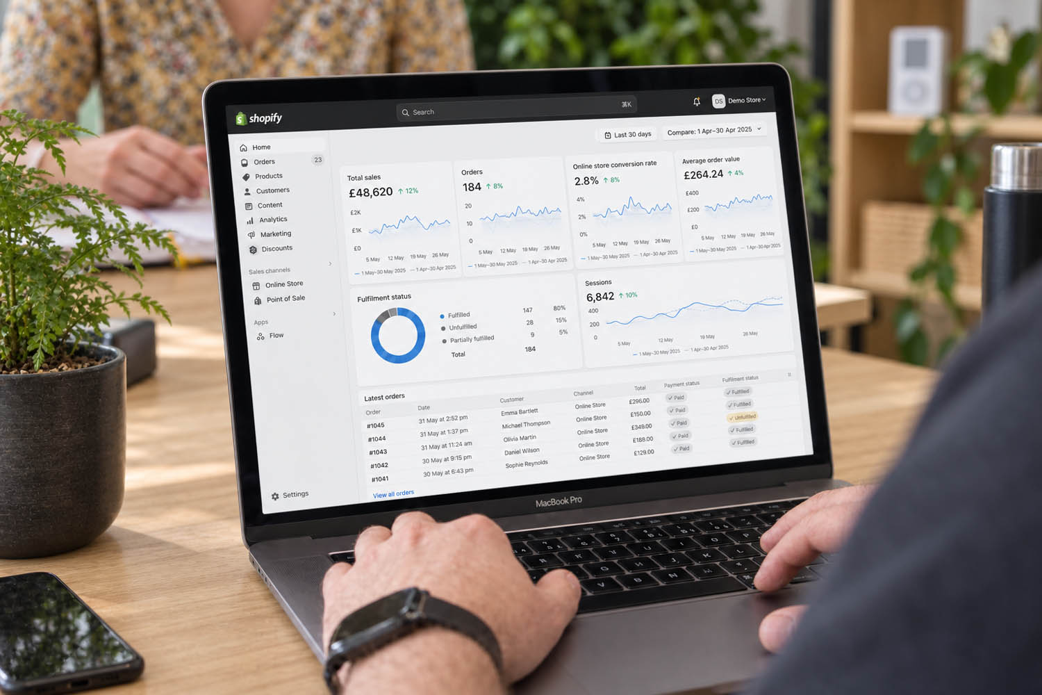 Reviewing Shopify store data on a laptop