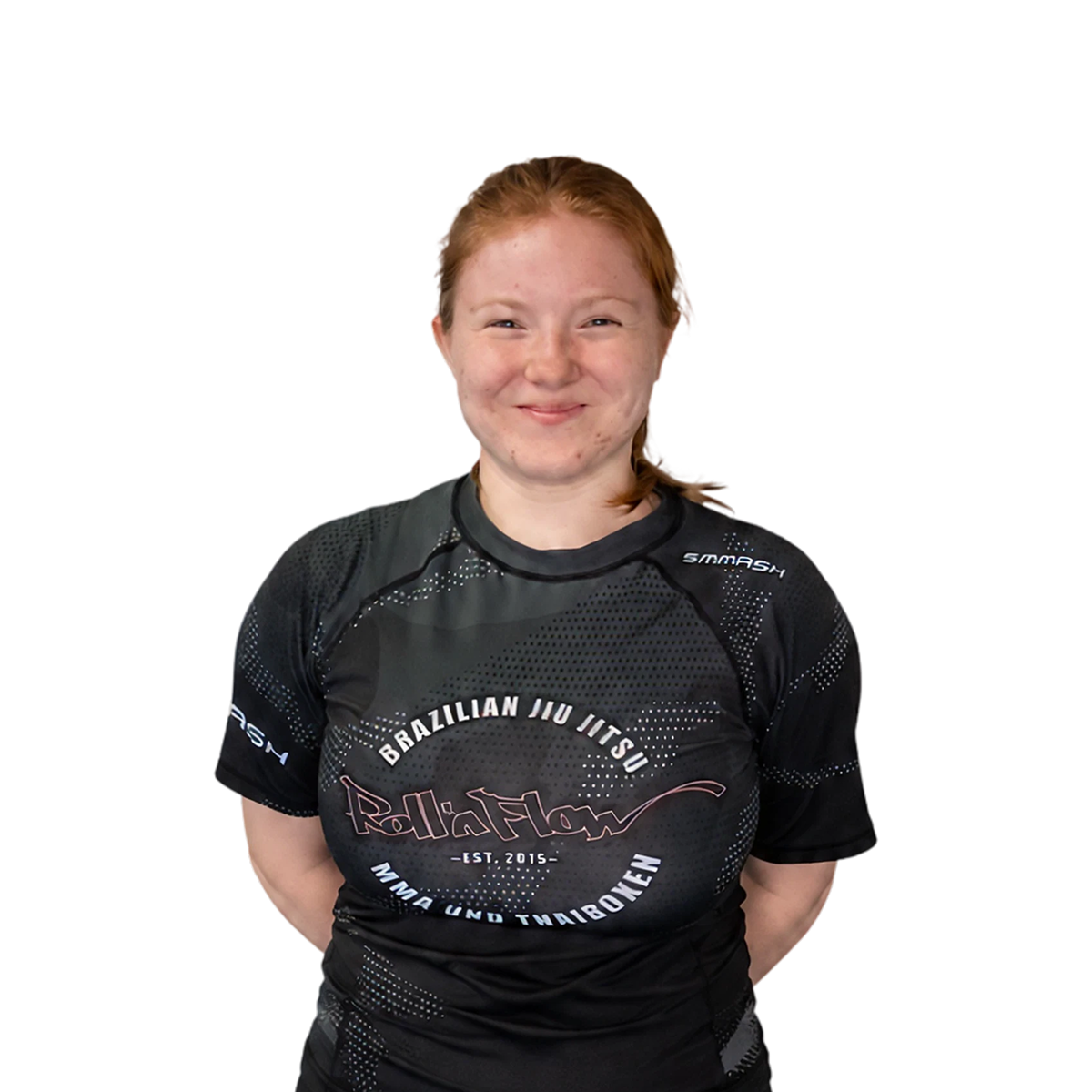 Lächelnde Jugendtrainerin Selina in einem Roll´n Flow Brazilian Jiu Jitsu Trainingsshirt.