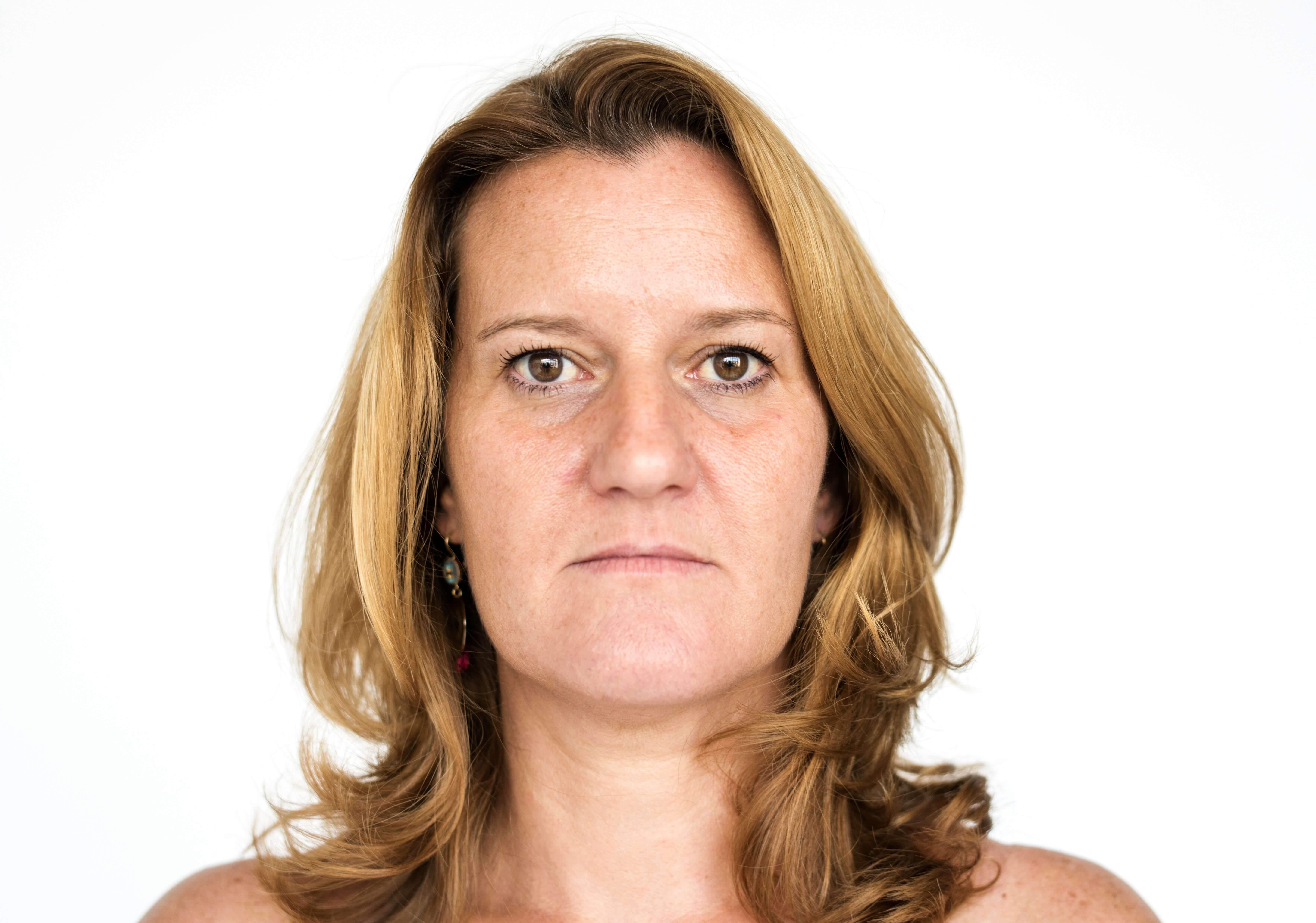 Close-up of mature lips showing fine vertical lip lines that naturally develop with age and collagen loss.
