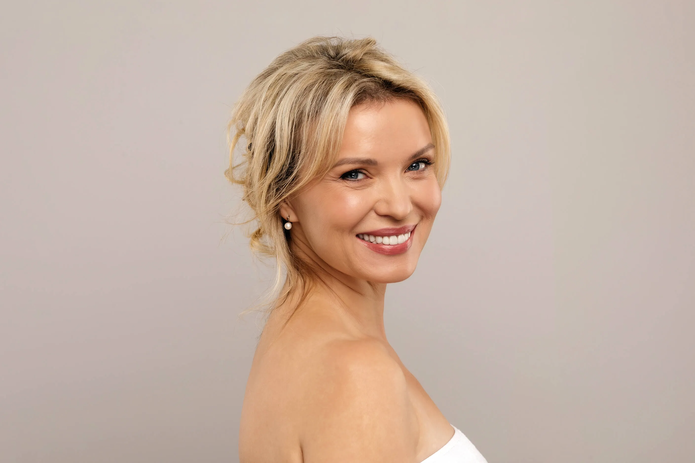 Woman showing balanced facial proportions and natural-looking facial balancing results after aesthetic treatment