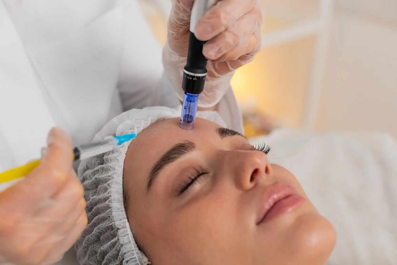 Provider performing a microneedling facial treatment to stimulate collagen production and support healthier-looking skin