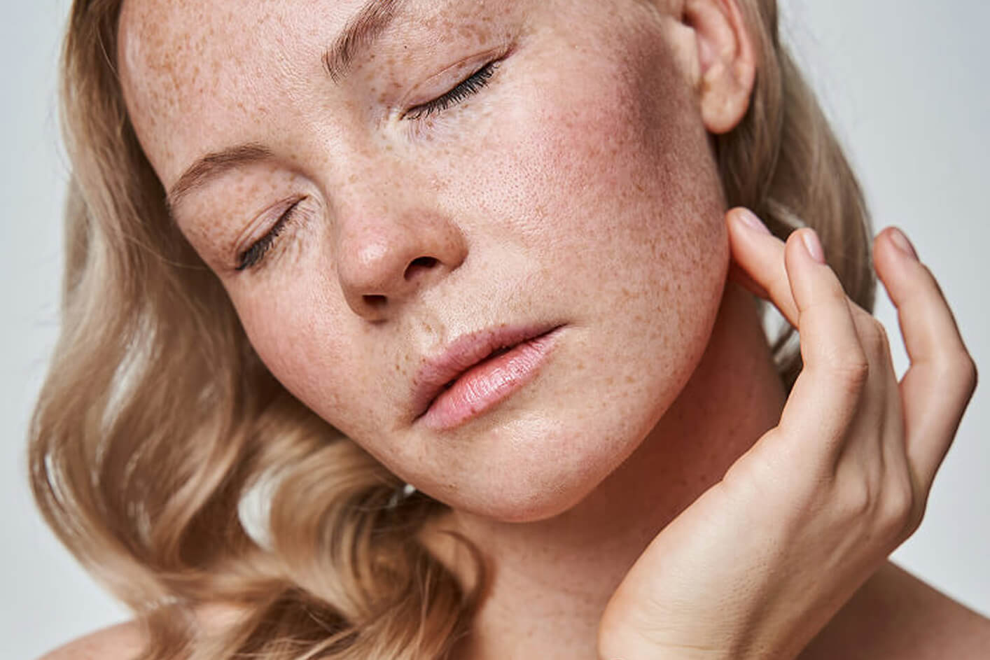 Woman in her 40s showing early pigmentation and fine lines as skin naturally changes with age