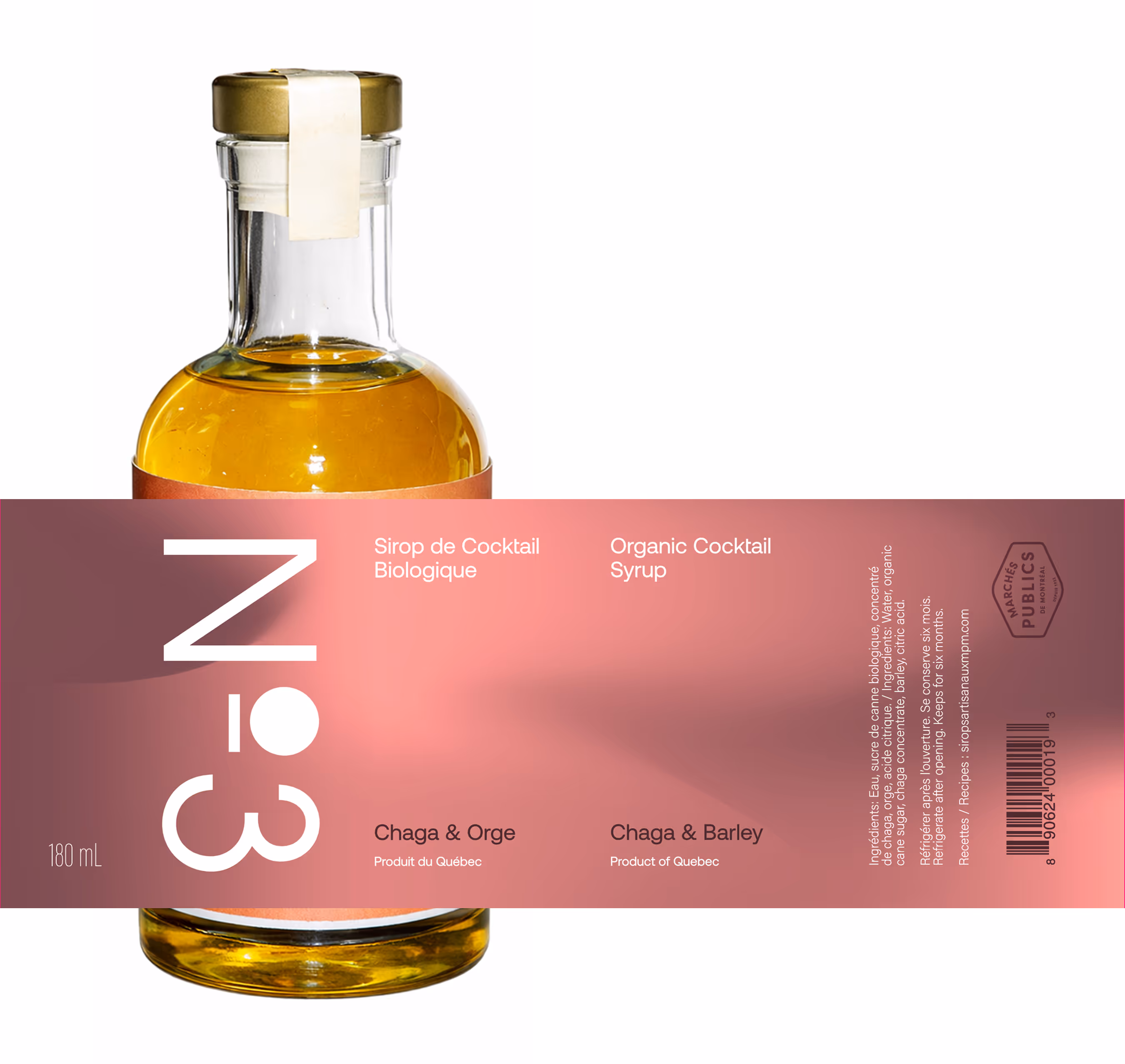 Image by Xhalia Martineau - Glass bottle with gold cap containing Organic Cocktail Syrup labeled Chaga & Barley, 180mL.